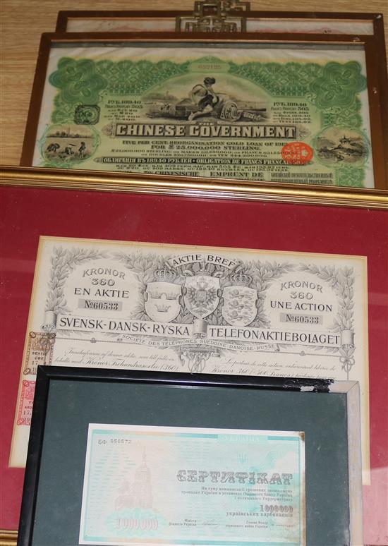 Two framed Chinese share certificates and a telephone certificate, and a Russian certificate